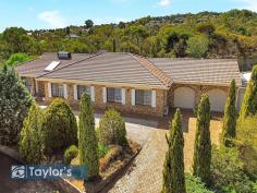  2 Kara Crescent Gulfview Heights SA 5096 $1,400,000 From an elevated position boasting sensational views, this valuable 1993sqm block is home to a spacious four-bedroom family residence. As 'eighties' as it is epic, an impressive floorplan invites large families to cultivate the update potential of a well-presented C.1985 home with multiple living areas and generous bedrooms. And subject to necessary approvals, this colossal landholding with panoramic views is also an enticing development prospect. Clearly, this home doesn't compromise on space. It features multiple outdoor living areas, a tennis court in need of refurbishment, an artificial lawn area and secure garaging for several vehicles, displaying as much generosity outdoors as it does inside. Accompanying the wing of bedrooms are formal and casual dining spaces, a formal sunken lounge and a living room that embraces open connectivity with two sets of bifold doors. The meat in the sandwich is the timber kitchen and adjoining casual meals area, providing an easy connection between indoor and outdoor living spaces. Fall in love with the view, stay for the land, and see what 2 Kara has to offer. Highlights: - 246sqm home built in 1985 on an elevated 1993sqm block - Large master bedroom featuring twin walk-through robes and a fully tiled ensuite - 2nd and 3rd bedrooms include built-in desks and wardrobes - 4th bedroom or home office - Central timber kitchen and adjacent meals area - Bifold doors connect the family living area - Formal dining semi-open to the formal sunken lounge - Tiled floors throughout - Fully tiled main bathroom with a corner spa - Double garage with auto roller doors features a w/c and kitchenette facilities - Auto roller door carport drives through to a second garage, storage shed or workshop - Greenhouse, aviaries and potential tennis court - Several undercover outdoor living areas Showcasing generous street frontage in a location central to several schools, local reserves, shops and public transport - this is an exciting opportunity. Contact Gavin Armstrong on 0408 802 350 for further information. 