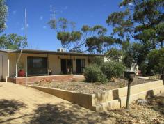  20 Pemberton St Cunderdin WA 6407 $480,000 Look no further walk through Entrance from front verandah to view spacious Lounge, Kitchen with ample cupboards pantry breakfast bar, eating area, separate Dining room can be used as a Office, 4 Bedrooms (3 with BIRobes), plus 2nd Lounge/Family room, Bathroom with Vanity Wc 2 Shower recesses, plus separate 2nd Wc, BI Linen cupboards, Laundry. Ceiling Fan Split Reverse Aircons Solar Panels Tile Fire Gas Cook/Top Electric HWS Amplimesh Security Doors Recently New Carpet in Lounge, Bedrooms, Hallway Recently Painted throughout Front/Back concrete floor Verandahs, spacious under cover entertaining area paved ready for BBQ, Double Garage with Roller Doors concrete floor power, Garden Shed, Rainwater Tanks, Veggie Gardens, Paved Driveway, Sandstone Blocks Front Fenced, Retic, New Colourbond Fencing, Below Ground Pool with New Wrought Iron Pool Fencing, connected to Scheme Water, Corner Block Size 2080 SQM. 
