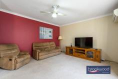  62 Railway Ave Middle Swan WA 6056 $575,000 Set on a wide-fronted lot, this designed family home offers the perfect balance of comfort and practicality with its sunken formal lounge, open-plan kitchen featuring rich walnut-toned cabinetry and three carpeted bedrooms. Ducted reverse cycle air conditioning brings year-round comfort, while the family room’s pitched timber-lined ceiling and sliding doors create seamless indoor-outdoor flow to the gable-covered alfresco area – perfect for entertaining. A standout bonus is the powered, lined and air-conditioned shed, previously used as a music studio, providing versatile space for whatever your lifestyle demands, all within easy reach of Midland city centre, schools and the beautiful Swan River. 3 bedrooms 1 bathroom 1981-built brick and iron Formal & informal living OP Kitchen/meals area Pitched-roof family room Powered AC studio space Carport with roller door Gable covered alfresco 603 sqm fenced backyard Close to transport/shops Follow the brick path that curves gracefully to the welcoming verandah of this wide-fronted family home. A tiled entry greets you as you cross the threshold. To your right, a sunken lounge creates a formal living area. Plush carpeting, a ceiling fan and an east-facing bay window create a perfect retreat for quiet evenings or entertaining guests. Ducted reverse-cycle air conditioning and individual units throughout the home ensure your comfort regardless of the season. The heart of this home unfolds as you move forward into the open-plan kitchen and dining area. Here, the practical meets the stylish: a U-shaped bench provides ample workspace, a freestanding oven, and rich walnut-toned cabinetry offers generous storage above and below. A clever servery connects the kitchen directly to the family room, making entertaining effortless. Convenience was clearly a priority in this home’s design. One side of the kitchen leads to a walk-through laundry that connects directly to the carport with its roller door. This transforms the mundane tasks of unloading groceries or shepherding children from car to home into a seamless experience. The family room features a distinctive pitched ceiling with timber lining. Sliding doors open to a gable-covered alfresco area, creating a natural flow between indoor and outdoor living spaces, an essential feature of modern living. Three carpeted bedrooms and a family bathroom sit off a short central hall extending from the open-plan living zone. Two bedrooms have built-in robes, and the main bedroom has a ceiling fan for additional comfort. Three carpeted bedrooms and a family bathroom sit off a short central hall extending from the open-plan living zone. Two bedrooms have built-in robes, and the main bedroom has a ceiling fan for additional comfort. A powered and lined shed with a roller door sits along the northern boundary, offering practical multi-use potential. Previously a music studio, this air-conditioned, versatile space could serve as a retreat, a teenager’s sanctuary, or a dedicated creative workspace – a valuable bonus room with multiple uses. Location completes this property’s appeal, with Midland city centre, arterial roads, and schools, including North Metropolitan TAFE, all within easy reach. Nearby parks, sporting facilities, and the natural splendour of the Swan River support active lifestyles. This home offers comfort, convenience, and scope for personalisation, perfect for first-home buyers ready to put down roots or downsizers unwilling to compromise on space and lifestyle. 
