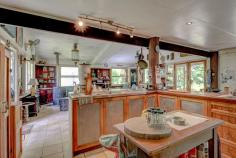  265 Jackson Road Shell Pocket QLD 4855 $750,000 "Rum Jungle" as it's affectionately named, is a secluded, yet not remote rainforest hideaway just 20 minutes from the tropical paradise of Mission Beach. Approximately 4 acres of this 8 acre (3.35 ha) property is cleared to form lush tropical gardens, lawns and a 2 story home, freestanding extra bedroom/office, pool, garaging for 5 vehicles and an authentic Balinese hut. Access is via a bitumen rural road and a good all weather gravel road through tunnels of lush rainforest. Cairns Domestic and International Airport is 90 minutes north along National Highway 1. Within a radius of 10 - 20 mins travel there are the following amenities: The El Arish Tavern, Roadhouse (under construction), beautiful golf course, 14 km coastal strip of Mission Beach with its Clump Point Boating Harbour and 12 tropical islands (including Dunk and Bedarra), coral reefs, Post Office and Shops. "Rum Jungle "is off grid with the latest (6-month-old) 9 KVA solar system including battery storage plus a 5 KVA system with its own battery storage as well ...all sufficient to power air conditioning, washing machine, pool pump, power tools etc Other features of this remarkable property include: - Freehold acreage with estimated 300-400 m of permanent creek frontage( Maria Creek) and frontage to State Forest. - 20 - 30 mins to doctors, hospitals and services (in Mission Beach, Tully or Innisfail) -The major provincial town Innisfail is approx.. 40 minutes to the north and Tully approx. 20 mins to the south - Exotic all timber and steel construction of improvements - Pool side office/bedroom and sunroom - Furniture and machinery available including tractor, implements, generators, pumps, power tools and more - 6 water tanks provide more than adequate quality water from pristine Maria Creek - A selection of tropical fruit trees including clumps of delicious Cavendish Banana trees are spread throughout the property. "Rum Jungle" is a nature lovers paradise with a fascinating array of native animals including the giant Cassowary, colourful pigeons, vibrant butterflies, platypusses, wallabies and numerous bird species. Absolutely stunning neighbourhood of valleys and rainforest clad mountain ranges. Only a handful (about 6) owners share this stunningly beautiful valley, all on private small acreages. Crystal clear swimming holes and white sandy riverbanks are at your disposal to cool off. Extremely private, quiet and serene location. The Property is located on a "no through" road (Jackson Rd (North) towards the head of a spectacular valley. The access road is maintained by the local Shire Council. This property is seriously for sale as the owners have a firm commitment to buy a property interstate. It is an extremely rare find! Time to Plan your Escape! Don't Miss Out! 