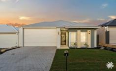  4 Jennings St Hammond Park WA 6164 $800,000 Step into modern comfort and effortless style with this newly built 4-bedroom, 2-bathroom home, completed in 2021 and designed with functionality and family living in mind. Positioned on a landscaped block with fresh new lawns and full reticulation, this home is ready for its first proud owners to move in and enjoy. From the moment you arrive, the attention to detail is clear. The home features a double garage with an integrated workshop space – ideal for the home handyman or hobbyist. Inside, the open-plan living and dining area offers a sense of space and flow, complemented by soaring 31-course ceilings and a built-in buffet for additional storage and style. The heart of the home is the well-appointed kitchen, complete with stone benchtops, a premium Westinghouse 900mm cooking package (oven, cooktop and rangehood), and sleek modern cabinetry. Entertain or cook with ease in a space that blends style with practicality. Each of the four bedrooms is generously sized, featuring mirrored built-in robes, while the master suite impresses with a walk-in robe and a private ensuite fitted with a luxurious double vanity. The central bathroom and laundry continue the home’s theme of quality finishes and smart design. Comfort is year-round with a Samsung smart ducted reverse-cycle air conditioning system, zoned for efficiency and controlled via mobile for ultimate convenience. Offset your power bills with the added solar system. Outdoors, enjoy a resort-style atmosphere with a salt-chlorinated swimming pool, an alfresco entertaining area, and a custom-designed fire pit zone – perfect for weekend gatherings or quiet evenings under the stars. Additional features include: • Fully reticulated landscaping • Double garage with workshop nook • Zoned smart ducted air conditioning (Samsung) • Stone benchtops throughout • Built-in buffet in main living • Saltwater swimming pool • Outdoor fire pit sitting area • High ceilings throughout This is a rare opportunity to own a stylish, low-maintenance home with all the modern comforts in a move-in-ready package. 