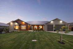  22 Hermitage Drive Moama NSW 2731 $1,685,000 to $1,795,000 This exquisite build is noticeably extravagant from the street and from the moment you walk through the front door. From the three metre high ceilings to the six metre long stone kitchen island bench, every little detail has been well thought out and presented exceptionally. As you walk through the front door you enter an impressive open plan kitchen, living and dining area. The kitchen is fully equipped with high quality Bosch appliances, an induction cooktop and a dishwasher. Additionally there is a butlers pantry for the storage of a fridge and appliances. The kitchen has a substantial amount of storage under the stunning six metre stone island bench and overhead cupboards. There is also a servery with a stone bench top and a bifold window perfect to enjoy an afternoon champagne or a morning coffee overlooking the pool and backyard. On the left hand wing of the home you will find three spacious bedrooms with built-in robes, block out blinds and ceiling fans. The elegant main bathroom has floor to ceiling tiles, a stone bath and stand-out high-class ABI brushed copper tapware. Following on down the hall is a separate powder room, a study area with a built in desk and a luxury laundry with extensive storage. In the opposite wing you will find the main suite and second living area or parents retreat. The main bedroom is overflowing with space and overlooks the inviting 8x4 magnesium solar heated pool through sliding doors. The master suite also has a generous sized walk-in-robe and ensuite with floor to ceiling tiles, custom built 6m timber vanity with ABI brushed copper tapware. Outside there is a huge outdoor area fitted with blinds, an outdoor kitchen with BBQ and a Jet Master fireplace perfect for the cooler nights. All lawns and gardens are low maintenance and are fitted with automatic sprinkler systems. There is an additional toilet outside with a vanity perfect for when entertaining or using the pool, avoiding the need for people to go inside. The garage has a double and single doors with 4 metre high clearance, perfect for the storage of a caravan and/or boat along with 4 additional car spaces. The home is kept comfortable throughout the year with commercial double glazed and louvre windows, evaporative cooling and ducted gas heating. Fitted with 8.2 kw solar panels to keep your energy bills at a minimum. 