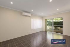  Unit 4/23 Coongan Ave Greenmount WA 6056 $599,000 Discover the magic of a well-considered floor plan, a cohesive palette of colours and materials, and an incredibly convenient location. Nestled within a small, secure complex, this contemporary strata unit presents an enviable lifestyle opportunity. Positioned opposite a reserve and mere steps from the Heritage Trail, the property combines the best of urban convenience with a sense of peaceful retreat. Low strata fees, a private outdoor entertaining space, and a two-car garage with storage elevate this impeccably presented unit above the ordinary. 3 bedrooms, 2 bathrooms 2017-built brick and iron Open-plan kitchen lounge Kitchen w stone benchtops Sep junior bedroom wing Alfresco entertaining UMR 2-car garage with shoppers’ Secure 206 sqm block Low maintenance living Close airport Midland Trail A small front garden behind a low wall leads to this nearly new unit’s front door and entry hall. To one side, the principal suite, and to the other, a shoppers’ entry from the two-car garage. A split-level design creates a clever separation of spaces, with the principal suite strategically positioned to offer a tranquil retreat from the home’s social areas. The main bedroom is a sanctuary featuring plush carpeting, an elegant ceiling fan, a spacious walk-in robe, and a chic ensuite that elevates your daily routine. Steps lead up to the open-plan kitchen, meals, and family room. High ceilings and large windows ensure this central living zone is filled with natural light. A generous sliding door dissolves the boundary between indoor comfort and outdoor freedom, inviting the landscape into each day. A carefully curated colour palette creates visual harmony throughout the home. Crisp white walls provide a clean backdrop for sophisticated grey undertones, complemented by subtly patterned floor tiles, plush bedroom carpeting, and elegant stone benchtops that tie the entire home together with a cohesive design. In the generously proportioned kitchen, a splashback of textured white tiles echoes the sleek finish of high-gloss cabinets topped with a U-shaped stone benchtop. A built-in pantry, overhead and under-bench storage, an electric oven, and a gas hob provide cooks with everything they need to excel in their culinary adventures. A private courtyard-style garden at the home’s northeast corner extends your living space. It includes a paved dining area partially sheltered under the main roof, perfect for alfresco entertaining and seamless indoor-outdoor living. The home’s junior wing offers two well-appointed bedrooms, each with built-in wardrobes and one with a ceiling fan. A generous family bathroom, convenient walk-through laundry, and substantial linen storage complete the practical design. From the convenient two-car garage to the meticulously designed interior, this home represents modern living at its finest – where every detail combines to create a beautiful and brilliantly functional space. First home buyers, FIFO workers and downsizers, your new lifestyle awaits, offering comfort, style, and an unparalleled living experience. 