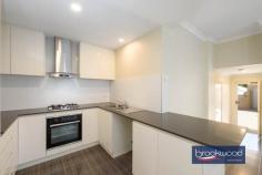  Unit 4/23 Coongan Ave Greenmount WA 6056 $599,000 Discover the magic of a well-considered floor plan, a cohesive palette of colours and materials, and an incredibly convenient location. Nestled within a small, secure complex, this contemporary strata unit presents an enviable lifestyle opportunity. Positioned opposite a reserve and mere steps from the Heritage Trail, the property combines the best of urban convenience with a sense of peaceful retreat. Low strata fees, a private outdoor entertaining space, and a two-car garage with storage elevate this impeccably presented unit above the ordinary. 3 bedrooms, 2 bathrooms 2017-built brick and iron Open-plan kitchen lounge Kitchen w stone benchtops Sep junior bedroom wing Alfresco entertaining UMR 2-car garage with shoppers’ Secure 206 sqm block Low maintenance living Close airport Midland Trail A small front garden behind a low wall leads to this nearly new unit’s front door and entry hall. To one side, the principal suite, and to the other, a shoppers’ entry from the two-car garage. A split-level design creates a clever separation of spaces, with the principal suite strategically positioned to offer a tranquil retreat from the home’s social areas. The main bedroom is a sanctuary featuring plush carpeting, an elegant ceiling fan, a spacious walk-in robe, and a chic ensuite that elevates your daily routine. Steps lead up to the open-plan kitchen, meals, and family room. High ceilings and large windows ensure this central living zone is filled with natural light. A generous sliding door dissolves the boundary between indoor comfort and outdoor freedom, inviting the landscape into each day. A carefully curated colour palette creates visual harmony throughout the home. Crisp white walls provide a clean backdrop for sophisticated grey undertones, complemented by subtly patterned floor tiles, plush bedroom carpeting, and elegant stone benchtops that tie the entire home together with a cohesive design. In the generously proportioned kitchen, a splashback of textured white tiles echoes the sleek finish of high-gloss cabinets topped with a U-shaped stone benchtop. A built-in pantry, overhead and under-bench storage, an electric oven, and a gas hob provide cooks with everything they need to excel in their culinary adventures. A private courtyard-style garden at the home’s northeast corner extends your living space. It includes a paved dining area partially sheltered under the main roof, perfect for alfresco entertaining and seamless indoor-outdoor living. The home’s junior wing offers two well-appointed bedrooms, each with built-in wardrobes and one with a ceiling fan. A generous family bathroom, convenient walk-through laundry, and substantial linen storage complete the practical design. From the convenient two-car garage to the meticulously designed interior, this home represents modern living at its finest – where every detail combines to create a beautiful and brilliantly functional space. First home buyers, FIFO workers and downsizers, your new lifestyle awaits, offering comfort, style, and an unparalleled living experience. 