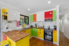  6 Berrigan Court Kin Kora QLD 4680 $375,000 Tucked away in a quiet cul-de-sac in sought-after Kin Kora, this vibrant and versatile home offers a unique blend of charm, comfort, and future potential. Fully air-conditioned for year-round comfort, this property is as functional as it is full of personality. Upstairs, you'll find two generously sized bedrooms, including an oversized master suite with private balcony access. The main living zone is warm and inviting, featuring polished timber floors, an open-plan lounge and dining area, and a quirky, retro-inspired kitchen that adds flair to everyday cooking. Step outside to a leafy, elevated deck-perfect for morning coffees or winding down at sunset. The low-maintenance yard and quiet position offer peace and privacy, all while being conveniently close to schools, shops, parklands, and the golf course. Downstairs, a second bathroom and a fully enclosed area with legal ceiling height on one side provide the flexibility to expand-ideal for creating a third bedroom, rumpus room, or a home office. The layout caters to growing families, creatives, or those working from home. Whether you're a first-home buyer looking for something with character, an investor chasing strong returns, or a downsizer wanting a low-maintenance lifestyle with flair, 6 Berrigan Court is the kind of home that stands out from the crowd. Positioned close to local schools, shops, and parklands, this home offers lifestyle, convenience, and future potential. 
