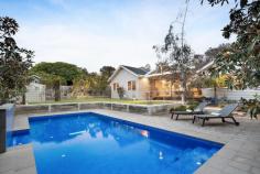  21 Thames Street Frankston South VIC 3199 $1,750,000 - $1,925,000 Nestled in a prestigious location along one of Frankston's most sought-after beachside streets, this stunning residence epitomises modern family living, offering families an exceptional foundation to thrive. Nestled just blocks back from Frankston Foreshore and Sweetwater Creek, the four-bedroom home invites you to savour a lifestyle steeped in refined coastal charm. Instantly cradled by a tapestry of native hues that resonate with the landscaped surroundings, the interiors open to richly grained timber floors, beckoning you to explore the three distinct living zones. Each with their own charm, formal and informal living for all ages balances a central family heart where lounge and dining space spills alongside a true chef's kitchen complete with 900mm cooking appliances, dishwasher, and island bench with breakfast bar. Glass stackers push back to bring a large covered alfresco into play for those summer occasions, where views across the self-cleaning, solar heated swimming pool with fountain, and private grassy play space keeps kids always within view. The four bedroom 2-bathroom accommodation arrangement highlights a rear master with large ensuite and walk-in robe, while a separate study/potential fifth bedroom offers adaptability for growing families. Gas ducted heating, evaporative cooling, downlights throughout, landscaped gardens, and ample off-street parking across a tandem carport furthers appeal. Set within the Frankston High School zone, and only moments from Bayside Shopping Centre, Frankston Hospital, Mount Eliza Village and Toorak College. 