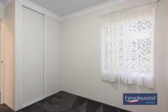  Unit 4/23 Coongan Ave Greenmount WA 6056 $599,000 Discover the magic of a well-considered floor plan, a cohesive palette of colours and materials, and an incredibly convenient location. Nestled within a small, secure complex, this contemporary strata unit presents an enviable lifestyle opportunity. Positioned opposite a reserve and mere steps from the Heritage Trail, the property combines the best of urban convenience with a sense of peaceful retreat. Low strata fees, a private outdoor entertaining space, and a two-car garage with storage elevate this impeccably presented unit above the ordinary. 3 bedrooms, 2 bathrooms 2017-built brick and iron Open-plan kitchen lounge Kitchen w stone benchtops Sep junior bedroom wing Alfresco entertaining UMR 2-car garage with shoppers’ Secure 206 sqm block Low maintenance living Close airport Midland Trail A small front garden behind a low wall leads to this nearly new unit’s front door and entry hall. To one side, the principal suite, and to the other, a shoppers’ entry from the two-car garage. A split-level design creates a clever separation of spaces, with the principal suite strategically positioned to offer a tranquil retreat from the home’s social areas. The main bedroom is a sanctuary featuring plush carpeting, an elegant ceiling fan, a spacious walk-in robe, and a chic ensuite that elevates your daily routine. Steps lead up to the open-plan kitchen, meals, and family room. High ceilings and large windows ensure this central living zone is filled with natural light. A generous sliding door dissolves the boundary between indoor comfort and outdoor freedom, inviting the landscape into each day. A carefully curated colour palette creates visual harmony throughout the home. Crisp white walls provide a clean backdrop for sophisticated grey undertones, complemented by subtly patterned floor tiles, plush bedroom carpeting, and elegant stone benchtops that tie the entire home together with a cohesive design. In the generously proportioned kitchen, a splashback of textured white tiles echoes the sleek finish of high-gloss cabinets topped with a U-shaped stone benchtop. A built-in pantry, overhead and under-bench storage, an electric oven, and a gas hob provide cooks with everything they need to excel in their culinary adventures. A private courtyard-style garden at the home’s northeast corner extends your living space. It includes a paved dining area partially sheltered under the main roof, perfect for alfresco entertaining and seamless indoor-outdoor living. The home’s junior wing offers two well-appointed bedrooms, each with built-in wardrobes and one with a ceiling fan. A generous family bathroom, convenient walk-through laundry, and substantial linen storage complete the practical design. From the convenient two-car garage to the meticulously designed interior, this home represents modern living at its finest – where every detail combines to create a beautiful and brilliantly functional space. First home buyers, FIFO workers and downsizers, your new lifestyle awaits, offering comfort, style, and an unparalleled living experience. 