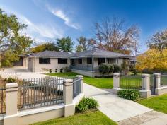  146 Douglas Street Armidale NSW 2350 $990,000 - $1,070,000 Welcome to 146 Douglas Street — a generously sized four-bedroom family home ideally positioned in the heart of Armidale. Just moments from shopping centers, the CBD, and leading private schools, this residence offers both convenience and comfort, with every feature thoughtfully designed for family living. Inside, you’ll find four spacious bedrooms, each with built-in wardrobes. The master suite is a true retreat, featuring its own living area, a luxurious ensuite with bathtub, and direct access to the covered alfresco area — perfect for morning coffee or evening relaxation. The remaining bedrooms are well-sized and share access to a beautifully appointed main bathroom with a double shower, while a third bathroom serves as a second ensuite, adding to the home’s everyday practicality. The heart of the home is the open-plan living, dining, and kitchen space — complete with polished timber floors, built-in TV cabinetry, reverse cycle air conditioning, and gas heating for year-round comfort. The modern kitchen is a chef’s dream, offering abundant storage, a dishwasher, breakfast bar, and an adjoining meals area. Step outside and the features continue: a fully fenced yard with electric gate, lush manicured lawns and gardens, a double garage plus double carport, and an impressive undercover entertaining area complete with built-in BBQ and pizza oven — ideal for hosting family and friends in style. This home is the perfect blend of space, location, and lifestyle. Don’t miss the opportunity to secure this exceptional property in one of Armidale’s most convenient and family-friendly pockets. 