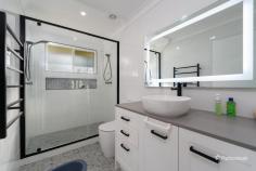  146 Douglas Street Armidale NSW 2350 $990,000 - $1,070,000 Welcome to 146 Douglas Street — a generously sized four-bedroom family home ideally positioned in the heart of Armidale. Just moments from shopping centers, the CBD, and leading private schools, this residence offers both convenience and comfort, with every feature thoughtfully designed for family living. Inside, you’ll find four spacious bedrooms, each with built-in wardrobes. The master suite is a true retreat, featuring its own living area, a luxurious ensuite with bathtub, and direct access to the covered alfresco area — perfect for morning coffee or evening relaxation. The remaining bedrooms are well-sized and share access to a beautifully appointed main bathroom with a double shower, while a third bathroom serves as a second ensuite, adding to the home’s everyday practicality. The heart of the home is the open-plan living, dining, and kitchen space — complete with polished timber floors, built-in TV cabinetry, reverse cycle air conditioning, and gas heating for year-round comfort. The modern kitchen is a chef’s dream, offering abundant storage, a dishwasher, breakfast bar, and an adjoining meals area. Step outside and the features continue: a fully fenced yard with electric gate, lush manicured lawns and gardens, a double garage plus double carport, and an impressive undercover entertaining area complete with built-in BBQ and pizza oven — ideal for hosting family and friends in style. This home is the perfect blend of space, location, and lifestyle. Don’t miss the opportunity to secure this exceptional property in one of Armidale’s most convenient and family-friendly pockets. 