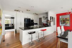  4 Palmerston Crescent Frankston South VIC 3199 $1,200,000 - $1,320,000 Taking full advantage of its prime beachside location atop Olivers Hill, just a leisurely stroll from Frankston Beach, Sweetwater Creek Reserve, and the Norman Avenue shops, this private home unveils a relaxed beachside lifestyle across its low-maintenance Frankston High School Zone address. With its thoughtfully designed four-bedroom layout that maximises natural light, this inviting home presents an exceptional opportunity for growing families eager to infuse their personal style into every corner. Introduced via solid timber floors and a dedicated lounge, where a charming gas log fireplace invites cosy evenings with loved ones, the single-level layout opens to a well-equipped kitchen that boasts premium appliances, including a Fisher & Paykel electric cooktop, Bosch wall oven, and dishwasher, making meal preparation a pleasure. The warmth of the summer air enhances a covered deck alfresco, providing a restful setting to watch the kids at play, or privately entertain with a serene garden backdrop featuring a children's cubby and double garage/storage. With four bedrooms each featuring ceiling fans, set alongside a main bathroom, compact study, dedicated laundry, large side shed, and ample off-street parking, the home's comforts continue with gas ducted heating and evaporative cooling. Ideal for young families and couples eager to embrace opportunities that nurture their creative vision, this 1,011sqm (approx.) block is just moments from Bayside Shopping Centre, Mount Eliza Village and public transport, allowing for a lifestyle that blends beachside leisure with everyday conveniences. 