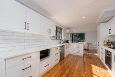  146 Douglas Street Armidale NSW 2350 $990,000 - $1,070,000 Welcome to 146 Douglas Street — a generously sized four-bedroom family home ideally positioned in the heart of Armidale. Just moments from shopping centers, the CBD, and leading private schools, this residence offers both convenience and comfort, with every feature thoughtfully designed for family living. Inside, you’ll find four spacious bedrooms, each with built-in wardrobes. The master suite is a true retreat, featuring its own living area, a luxurious ensuite with bathtub, and direct access to the covered alfresco area — perfect for morning coffee or evening relaxation. The remaining bedrooms are well-sized and share access to a beautifully appointed main bathroom with a double shower, while a third bathroom serves as a second ensuite, adding to the home’s everyday practicality. The heart of the home is the open-plan living, dining, and kitchen space — complete with polished timber floors, built-in TV cabinetry, reverse cycle air conditioning, and gas heating for year-round comfort. The modern kitchen is a chef’s dream, offering abundant storage, a dishwasher, breakfast bar, and an adjoining meals area. Step outside and the features continue: a fully fenced yard with electric gate, lush manicured lawns and gardens, a double garage plus double carport, and an impressive undercover entertaining area complete with built-in BBQ and pizza oven — ideal for hosting family and friends in style. This home is the perfect blend of space, location, and lifestyle. Don’t miss the opportunity to secure this exceptional property in one of Armidale’s most convenient and family-friendly pockets. 
