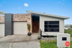  202 Dress Circle Coffs Harbour NSW 2450 $819,000 - $839,000 If you've been searching for a home that offers stunning views and a well-thought-out layout to suit a relaxed yet functional lifestyle, this could be just what you've been waiting for. Designed with space and privacy in mind, this property strikes the perfect balance between low-maintenance living and stylish comfort. Step through the elegant blackbutt timber front door and be welcomed into a spacious entryway that leads directly to the sunlit master suite. Featuring double-hung windows that capture the natural light, a walk-in robe, and a sleek ensuite, this retreat is both practical and peaceful. Convenient internal access from the remote-controlled single garage is also located on this level. Just a few steps down, you'll find the open-plan living, dining, and kitchen zone. While the interiors are beautifully appointed, the real showstopper is the view - take in sweeping sights of Muttonbird Island and the city escarpment from your living room. Whether you're entertaining friends, sipping a sunset cocktail, or curling up with a book, this space will quickly become your favourite spot in the home. Continue down and you'll discover a versatile space that could function as a second living area or third bedroom. Complete with a walk-in robe or storage space and its own private entrance, this room is ideal for a young adult craving a little independence. The main bathroom, finished in calming neutral tones with a full bathtub, is also located on this level. One more flight down and you'll find another generous bedroom featuring built-in robes, ceiling fans, and expansive windows that frame yet more breathtaking views. This room opens onto a deck - perfect for quiet study sessions or simply soaking in the scenery. You'll also find the laundry and drying area thoughtfully tucked away on this level. The outdoor spaces are beautifully landscaped for minimal upkeep, with enough room for pets to roam. Plus, nearby nature reserves and walking tracks make it easy to stay active and connected with the outdoors. Whether you're after a permanent home, a smart investment, or a weekend getaway, this property deserves your attention. 