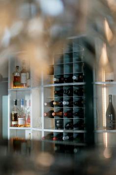  Wine racks are storage solutions designed to hold and organize wine bottles, helping to preserve the quality of the wine while adding a touch of elegance to your home. Available in various materials like wood, metal, and acrylic, wine racks come in a range of styles, from freestanding units to wall-mounted designs. They can hold anywhere from a few bottles to hundreds, making them suitable for casual wine enthusiasts or serious collectors. Whether used in a kitchen, dining room, cellar, or even as a stylish accent in the living room, wine racks not only keep bottles safely stored but also enhance the décor, allowing your wine collection to be displayed beautifully.