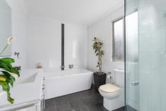  52-54 Parkes Street Helensburgh NSW 2508 $1,200,000 Welcome to 52-54 Parkes Street, Helensburgh - a delightful family home offering serene bush views. This inviting three bedroom residence features a master suite with a chic ensuite, and glass sliding doors that open onto a spacious deck, the perfect spot to enjoy your morning coffee. All three bedrooms offer built in robes and there is a bonus dressing room/home office off the master. The sun-drenched living area and dining area highlights the peaceful surroundings, and the stunning kitchen serves as the heart of the home, boasting an island bench, ample storage and generous bench space. Reverse cycle airconditioning and combustion fireplace ensures year round comfort. Set on a 1008m² block, the property includes tiered gardens with a variety of native trees and a lush lawn, adding to its charm. Relax on the deck, ideal for entertaining, and take in the views of the adjacent bushland, which is designated environmental land, ensuring your privacy. The home also features a single car garage, off street parking and is conveniently located within walking distance to schools, shops, and the railway station. This beautiful home is ready for you to move in and enjoy. A visit is a must to fully appreciate all it has to offer. Three bedrooms all with built in robes Modern family bathroom and chic ensuite Glass doors from both the master bedroom and living area to alfresco deck Stunning kitchen with island bench and ample storage and bench space Polished floorboards throughout living areas Airconditioning and combustion fireplace for year round comfort 1011.7 m2 parcel of land with tranquil bush outlook Walking distance to local schools and train station 