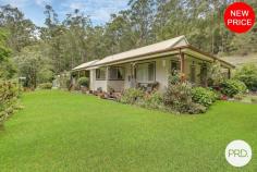  89 Lorne Road Kendall NSW 2439 $1,075,000 Nestled amidst the tranquillity of Kendall's semi-rural expanse, 89 Lorne Road offers an idyllic lifestyle for families, those looking to upsize to more spacious surrounds or even downsizers from a larger acreage seeking peace without compromise on space. This property is a true gem, set on a sprawling 16.77ha (41.4 acres) of predominantly bush land that beckons an easy-going rural lifestyle, you'll fall in love with its charm and also its picturesque nature walks that are accompanied by timber footbridges. This humble three-bedroom cottage radiates rural charm with its cathedral style ceilings in the main living areas, creating an airy and inviting space. The large wraparound timber deck provides the perfect vantage point to overlook the manicured gardens and beyond, offering a rural vista that is sure to captivate. Each bedroom comes equipped with ceiling fans and built-in wardrobes, ensuring comfort and convenience. The main bedroom features a walk-in robe and an ensuite, providing a private sanctuary within this charming home. The property boasts a sizeable and functional kitchen that opens up to the living spaces, perfect for family gatherings. The north facing aspect of the house means that natural light is in abundance, enhancing the warmth and homeliness of the cottage. Despite its private setting, 89 Lorne Road remains connected to local amenities. A mere 2-minute drive lands you in the heart of Kendall CBD with all essentials at hand, while the Kew Country Club is just 3.8km away for leisure activities like golf, mini-golf or lawn bowls. For the necessities and more, Woolworths Shopping Complex in Lakewood is an 8-minute drive, and the regional hub of Port Macquarie is within a 25-minute reach. Practical features haven't been overlooked with 50,000 litres of tank water storage and parking space for 4 vehicles. All this plus a 4-minute drive to the nearest boat ramp access into the Camden Haven River makes this property a perfect blend of convenience and rural living. This is a rare opportunity to acquire a piece of paradise with both space and serenity in spades. 