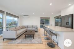  3 Fairview Drive Kingston TAS 7050 $645,000 - $705,000 Beautifully renovated and bathed in natural light, this stylish home is ready for you to simply move in and enjoy. The open-plan living zone features sleek timber flooring, a fresh neutral palette, and wide windows that frame stunning mountain views - creating a warm and inviting space to relax or entertain. The contemporary kitchen is a standout, complete with glossy cabinetry, a central island bench, subway tile splashback, and modern appliances, offering both style and functionality. There are three comfortable bedrooms, one with built-in robes, and a beautifully finished bathroom featuring a freestanding tub, modern vanity, and a sleek shower - designed for both relaxation and practicality. Glass sliders connect the living space to a entertainment deck overlooking the secure backyard - ideal for kids, pets, or a weekend barbecue. Downstairs, the lock-up garage offers excellent storage and workshop space, while the area under the home also presents exciting potential for further development (STCA). A side driveway leads to a large rear shed, perfect for those needing additional storage, hobby space, or a home workshop. An excellent opportunity for first home buyers or young families seeking a modern, low-maintenance lifestyle within easy reach of shops, schools, and everyday conveniences. 