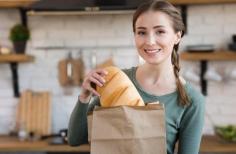  A cheerful delivery person stands outside a cozy suburban home in Melbourne, holding a basket filled with freshly baked loaves of bread. The background shows a delivery van branded with "Indian Supermart" , emphasizing reliable Bread Delivery in Melbourne . The scene captures a bright morning with golden sunlight highlighting the crusty, artisan-style breads, symbolizing freshness and convenience. The title "Bread Delivery in Melbourne – Fresh Loaves to Your Door" is subtly overlaid in elegant typography, reinforcing the focus on doorstep delivery of quality bread from a trusted Indian grocery source. 