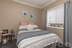  90 Broughton Street Tumut NSW 2720 Set upon an extremely generous and elevated allotment, sits this four-bedroom solid brick family home. Boasting four great sized bedrooms, two bathrooms, sun-filtered kitchen overlooking the easterly elevated aspect and with semi formal living and dining areas, all serviced by wood box fire heater. You will love the space afforded and potential on offer, in this large four-bedroom family brick home, offering further development options with such a large accessible allotment. Do not miss your opportunity, call today to book your inspection. Premiere Features: - Four great sized bedrooms, bedroom 1 and 2 interconnecting and bedroom 3 and 4 also interconnecting - Large well-maintained bathroom with separate shower and bath with single vanity and shaving cabinet - Separate toilet accessed via the bathroom - Sun-filtered kitchen with ample storage options, electric cooktop, dishwasher, great bench space and direct rear external access - Semi formal dining area positioned between the living and kitchen and serviced by wood box fire heater and air conditioning wall unit - Great size front living area - Large fully covered rear entertaining area or covered car park option with lighting - External laundry under the roof line - Additional second bathroom with shower and toilet accessible via the laundry - Fully fenced and pet friendly rear house yard - Garden shed - Total allotment of approximately 2,409m² with vehicle access throughout - Currently tenanted at $420 per week Do not miss your opportunity to secure such an expansive allotment with a solid family brick home. 
