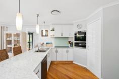  6 Cobbedah Dr Springfield NSW 2250 Positioned in one of Springfield’s most desirable pockets, this gorgeous home offers the perfect blend of space, style, and lifestyle convenience. This beautifully maintained four-bedroom home is set on a private block in a peaceful estate, making it ideal for families, downsizers, or anyone looking for easy, single-level living in a premium location. Step inside and be welcomed by two generous living spaces, perfect for relaxed family living and entertaining. The heart of the home is the stunning kitchen, complete with quality appliances, and striking pendant lighting over the breakfast bar—all seamlessly flowing into the open-plan living and dining area. Whether you’re hosting guests or enjoying quiet nights in, the layout offers effortless connection and comfort. Outside, the beautifully landscaped backyard provides a private oasis with low-maintenance gardens and room to relax or entertain. With four spacious bedrooms, two modern bathrooms, and a double garage, this home ticks all the boxes for practical everyday living. Features include: – Master bedroom equipped with modern bathroom and large walk-in wardrobe. – Three additional bedrooms ideal for additional guests or a growing family’s needs. – Showcasing quality appliances, walk in pantry and custom cabinetry, this kitchen is built to impress. – A sleek, contemporary main bathroom with quality finishes throughout. – Double garage with internal access. – Private, landscaped backyard – perfect for entertaining. – Sun-drenched bonus room, perfect for your morning coffee ritual. – Ducted air-conditioning and quality finishes throughout. Enjoy the best of both convenience and tranquillity. Just minutes to Erina Fair, Gosford CBD, and Terrigal Beach, with easy access to local schools, Springfield Reserve, public transport, and medical centres. Commuters will appreciate the proximity to Gosford Train Station and the M1 Motorway, while families will love the peaceful surroundings and sense of community. 