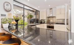 28 Letchworth Centre Ave Salter Point WA 6152 $2,000,000Positioned proudly on a leafy street corner in one of Salter Point’s most coveted enclaves, this architecturally designed residence is more than just a home – it’s a lifestyle statement. Crafted by the acclaimed Pirone builders, every detail has been thoughtfully curated to offer luxurious comfort, functional family living, and timeless design. Behind its elegant facade lies a sun-drenched sanctuary filled with warmth, space, and style. From the grand entrance to the flowing floor plan, this home is a masterclass in modern living. Expansive open-plan zones seamlessly blend, offering formal and informal spaces for entertaining or quiet retreats, including a cozy parents lounge, garden view study, and casual family areas designed to bring everyone together. The chef’s kitchen is a dream, complete with sleek stone benchtops, premium appliances, stylish cabinetry, a breakfast bar, and abundant storage, making daily living and entertaining an effortless affair. Upstairs, the luxurious master suite is your private haven, complete with a sitting area, walk-in robe, ensuite with spa, and a private balcony overlooking the street. A second upstairs bedroom with its own ensuite offers ideal accommodation for guests or teens. Downstairs, the additional bedrooms all feature built-in robes and share a stylish bathroom and separate powder room. Step outside and be wowed by the resort inspired alfresco zone and a private stunning heated magnesium swimming pool which is perfect for year-round enjoyment. A double remote garage with shopper’s entrance, storage area, and rear access to a garden shed adds practicality to luxury. Extra features to love : • Tasmanian Blackbutt timber flooring • Evaporative and reverse cycle air conditioning • Alarm system & NBN connectivity • Fully reticulated, private landscaped gardens • 4.8kW solar system with battery storage • Plantation shutters throughout Perfectly located just a short stroll from riverside paths, local cafés, Aquinas College, Curtin University, and Canning Bridge Station, this exceptional home places everything you need right at your doorstep. 