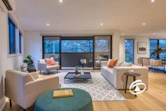  29 Willowdene Way Berwick VIC 3806 $1,050,000 - $1,150,000 Sophisticated Style, Steps from Berwick Village Positioned within the prestigious and architecturally designed Hark complex, this as new tri-level townhouse offers an exceptional fusion of modern elegance, premium finishes, and low-maintenance living — all within just 500 metres of the vibrant Berwick Village. Designed with both comfort and functionality in mind, the home features three spacious bedrooms, each thoughtfully appointed with ample storage. The master suite is privately situated on the lower level, creating a tranquil retreat complete with a sleek ensuite and a generous walk-in robe. The upper level unveils the heart of the home — a light-filled, open-plan living and dining domain that flows effortlessly onto a private balcony with elevated park views. At the centre is a beautifully appointed kitchen showcasing stone benchtops, premium stainless-steel appliances, a walk-in pantry, and an integrated dishwasher. This space is equally suited to casual daily living and elegant entertaining. Throughout the home, split system heating and cooling in every room ensure year-round comfort, while the double remote garage with internal access adds both security and convenience. Professionally landscaped, low-maintenance gardens complete the picture, allowing you to enjoy the lifestyle without the upkeep. High ceilings and refined contemporary finishes elevate the overall aesthetic, offering a sense of space, sophistication, and ease. Ideal for professionals, downsizers, or discerning investors, this impeccable residence offers a rare opportunity to secure a stylish, turn-key property in one of Berwick’s most sought-after addresses. With boutique cafés, restaurants, shopping, and public transport just a short stroll away, you’ll enjoy the perfect blend of cosmopolitan living and suburban tranquility. 