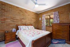  230 Naranga Pl Stoneville WA 6081 $1,100,000 Secluded at the end of a quiet Cul-de-Sac, this Hills homestead with wrap-around verandahs comes with all the extras essential to a well-rounded rural lifestyle. Sheltered outdoor living and entertaining space, a below-ground pool, a large workshop with 3-phase power, various outbuildings and gardens planted with productive fruit trees paint a picture of an idyllic Perth Hills lifestyle. 4 bedrooms 2 bathrooms 1980s-built brick and iron Country-style eat-in kitchen Formal lounge with SC fire South-facing alfresco ent Huge powered workshop B-ground swimming pool Ducted evap 6 kW solar 4.6 acres parkland cleared Top of private Cul-de-Sac A classic Australian design delivers relaxed comfort and practical style in a home with expansive outdoor living space and the extras essential to a well-rounded Hills lifestyle. An iconic wrap-around verandah leading to multiple entry points – including a formal lounge and a spacious eat-in kitchen—offers flexibility and a sense of generosity that immediately sets this property apart. The kitchen is the true heart of the home, featuring exposed brick and pine finishes and a warm, inviting atmosphere. This unmistakable sense of ‘home’ continues in the formal lounge, where a slow-combustion fireplace offers a focal point and the promise of cosy nights during the cooler months. A home office arranged off the lounge provides a secluded space for uninterrupted work and study. The principal bedroom, with a built-in robe and ensuite, sits at one end of the plan. The junior bedrooms – each with a ceiling fan and built-in robe – share the family bathroom, which is fitted with a tub, shower, and vanity. A sizeable south-facing verandah and gable-covered patio extend the living space, creating an extraordinary indoor-outdoor flow that celebrates every season. Whether basking in the soft winter sunlight or enjoying nature’s symphony on a summer night, this home offers an unparalleled living experience. Alfresco entertaining rises to new heights with pool and garden views, creating the impression of a private retreat. Arranged at one end of the patio is a spacious, lined and powered storeroom and a two-car carport. When the time for relaxing is over, this exceptional property has got you covered with a massive 9 m x 18 m 3-phase workshop with a machine shelter of the same size, an insulated sea container and various smaller outbuildings providing ample space for work, storage and creativity. The potential to keep a pony, multiple rainwater tanks, productive fruit trees – among them citrus, apple, apricot, and fig –and a 6 kW solar array add to an authentic Hills lifestyle. This secluded, family-friendly neighbourhood is only a few minutes from Mundaring, where you will find shopping, services, schools, parks, cafes and transport. The real beauty of this property is found in the tranquil natural surroundings, the freedom of abundant space and the scope to create a life in a classic Perth Hills setting. 