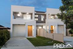  76A Morotai Road Revesby Heights NSW 2212 This stunning 5-bedroom duplex is a rare find, combining the enduring quality of full-brick construction with thoughtful design and modern finishes. Situated in a quiet street, minutes from Revesby express train station, this home offers unmatched convenience and space, perfect for families or astute buyers seeking luxury, low maintenance and longevity. Property Flyover: - Full-brick construction with a suspended concrete slab giving exceptional durability, insulation, and timeless appeal. - Spacious, open plan lounge and dining space. - Large stone kitchen with gas cooking, butler's pantry and premium finishes. - Ground-floor bedroom with an ensuite; perfect for guests or older relatives. - Convenient downstairs powder room. - Four spacious upstairs bedrooms with built-in wardrobes. - Tucked away master suite with ensuite, large walk-in robe and balcony. - Second lounge/study, ideal for those working from home or children's "hang out" space. - Alfresco with built-In kitchenette, perfect for year-round entertaining. - Flat child friendly backyard, drenched in natural light. - Single garage plus off street parking for a further two cars. - Prime Location: Minutes to Revesby express train station, surrounded by quality homes. - 926 bus to Revesby, Padstow, Bankstown Hospital and Bankstown City centre. - Easy walking distance to local shops, great schools and Georges River bush walks. This is not just another duplex; it's a home built to stand the test of time. 