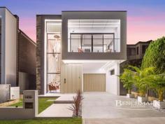  149 Longstaff Ave Chipping Norton NSW 2170 Welcome to this newly built, architecturally designed luxury residence that blends elegance, functionality, and space perfect for modern family living and effortless entertaining. Boasting 5 spacious bedrooms, including a convenient ground-floor guest bedroom, this home is ideal for extended families or those who love to host. Upstairs, the master suite is your private retreat, complete with a stylish ensuite, walk-in robe, and its own balcony. All remaining bedrooms feature built-in wardrobes, and there's even a dedicated study for working or learning from home. Key Features: 5 well-appointed bedrooms Including one on the ground floor Master suite with private ensuite, walk-in robe & balcony Built-in wardrobes in all other bedrooms Study/home office Designer kitchen Featuring gas cooking, a walk-in pantry, dishwasher & high-end finishes 2 covered alfresco areas Both with kitchenettes, ideal for year-round entertaining Open-plan living & dining zones with luxury finishes and natural light Ducted air conditioning throughout Security system including cameras & alarm for peace of mind Low-maintenance backyard Still with plenty of space for children to play Double garage with internal access This home offers a perfect blend of indoor luxury and outdoor livability ideal for growing families, professionals, or anyone seeking comfort without compromise. 