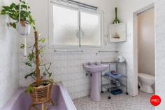  18 Ophir Street Golden Square VIC 3555 $500,000 - $550,000 Offered to the market for the first time in decades, this classic weatherboard home on a generous 693m² (approx.) block presents an exciting opportunity to restore, renovate or redevelop in one of Golden Square's most sought-after pockets. Brimming with original character and vintage charm, the home boasts a flexible floorplan featuring two spacious bedrooms, a central bathroom with retro lilac fittings, and multiple living zones. A formal lounge at the front of the home provides a cozy space for entertaining, while the expansive rear family room opens up possibilities for conversion into a third bedroom, home office or additional living area. The heart of the home is a retro kitchen with built-in cabinetry, ample bench space, and adjoining dining area-retaining its original colour palette and design details for the nostalgic buyer or creative renovator. The full-size laundry includes external access and extra storage, while the home also includes two storage areas within the layout for practicality. Outside, the expansive backyard features established gardens, two separate sheds, and ample lawn space-perfect for growing families, pets, or future development (STCA). With a wide driveway and plenty of off-street parking, the property is positioned for convenience with excellent potential. Located just moments from St John of God Hospital, Cooinda Park, Golden Square Primary School, and only minutes to Bendigo CBD, this is an opportunity not to be missed. Key Features: • Generous 693m² (approx.) allotment with dual sheds and lush gardens • Flexible floorplan with two large living zones and two bedrooms • Charming original kitchen, bathroom and period details throughout • Prime location close to schools, parks, hospital and Bendigo CBD 