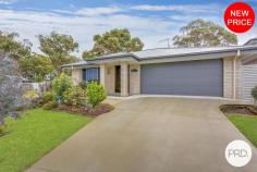  5 Golden Grove Dunbogan NSW 2443 $890,000 - $940,000 Nestled in the serene neighbourhood of Dunbogan and boasting a splendid blend of luxury and ease, 5 Golden Grove is a contemporary haven tailor-made for discerning downsizers, retirees, or astute investors. This modern three-bedroom, two-bathroom house is situated on a comfortably-sized 479.6sqm plot, ensuring a low maintenance lifestyle, mere moments from the tranquil beaches that define this idyllic locale. The residence greets you with a free-flowing floorplan accentuated by natural light filtering through elegant plantation shutters. Every detail speaks of quality, from the floor to ceiling tiles that grace the bathrooms, featuring a "his and hers" vanity in the ensuite, to the 40mm stone benchtops and modern appliances that make the kitchen both a functional and stylish space. Living areas transition seamlessly to the outdoors, where a large, covered timber deck offers a spectacular outlook to North Brother Mountain. The outdoor space, complete with a low maintenance yard, invites effortless entertainment or a peaceful retreat for a morning cuppa. A gentle 450m stroll unveils the golden sands of Dunbogan South Beach, while a 5-minute drive brings the soothing waves of Pilot Beach to your doorstep. Boating enthusiasts will appreciate the proximity to the nearest boat ramp, a mere 1.7km away, and the convenience of Laurieton CBD's amenities within a 5-minute drive. This property presents a remarkable opportunity to acquire a slice of coastal paradise, without compromising on comfort or quality. Embrace a life where beachside bliss meets modern luxury at 5 Golden Grove. 