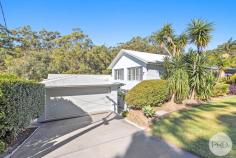  48 Navala Avenue Nelson Bay NSW 2315 Nestled within the tranquil and picturesque surrounds of Nelson Bay, this exquisite split-level residence has been meticulously designed and curated to meet the needs of a growing family seeking both comfort and style. Privately positioned well back from the street, the home is framed by lush, mature hedging that provides a natural barrier, enhancing privacy and creating a serene sanctuary. The exterior boasts a modern brick-render façade that combines timeless appeal with contemporary design, setting the tone for the quality found throughout the property. Upon entering, you are immediately welcomed by soaring angled ceilings that create a sense of grandeur and spaciousness. The interior flows effortlessly through a thoughtfully crafted open-plan layout, accentuated by a sophisticated, neutral colour palette that complements the natural light flooding in from multiple aspects. Designed with functionality and family living in mind, the split-level configuration allows each area to be perfectly positioned for privacy, noise control, and ease of access, resulting in a harmonious balance of shared and private spaces. The generous proportions are evident throughout, offering a true sense of openness and freedom that will impress even the most discerning buyer. At the rear of the home, step out to a private leafy backdrop of mature trees and greenery, providing a peaceful and secluded environment ideal for relaxation and outdoor entertaining. This tranquil setting ensures a connection to nature while maintaining complete privacy, making it a perfect retreat for both adults and children alike. The residence features five spacious bedrooms, each thoughtfully appointed with built-in wardrobes to accommodate ample storage needs. The master suite, along with additional bedrooms, ensures comfortable accommodation for family members and guests. In addition, a separate self-contained guest accommodation offers a private kitchen, bedroom, bathroom, and living space, ideal for extended family visits or potential rental income. Featuring: - 5 bedrooms of accommodation with a separate 1-bedroom flat - A secure double lock-up garage providing ample space for vehicles - Massive storage are underneath the home - Stunning gourmet kitchen - Durable and stylish tiled flooring throughout - Ducted air conditioning combined with ceiling fans - Glass sliding doors that seamlessly connect the indoor living areas to a spacious undercover balcony - Two distinct living spaces, offering versatility for family relaxation and entertaining - Tasteful white plantation shutters adorning all windows, providing both privacy and a classic aesthetic Location: - 2 minute drive to Nelson Bay CBD - 5 minute drive to Salamander Bay Shopping Centre - 8 minute drive to Shoal Bay Beach - 3 minute drive to Fly Point Beach This home is a rare opportunity to secure a beautifully presented, spacious, and thoughtfully designed family residence in one of Nelson Bay's most peaceful and sought-after locations. Whether you're looking to expand your family's living space, entertain guests, or enjoy a quiet lifestyle surrounded by nature, this property offers endless possibilities. 