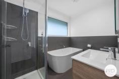  3 Fairview Drive Kingston TAS 7050 $645,000 - $705,000 Beautifully renovated and bathed in natural light, this stylish home is ready for you to simply move in and enjoy. The open-plan living zone features sleek timber flooring, a fresh neutral palette, and wide windows that frame stunning mountain views - creating a warm and inviting space to relax or entertain. The contemporary kitchen is a standout, complete with glossy cabinetry, a central island bench, subway tile splashback, and modern appliances, offering both style and functionality. There are three comfortable bedrooms, one with built-in robes, and a beautifully finished bathroom featuring a freestanding tub, modern vanity, and a sleek shower - designed for both relaxation and practicality. Glass sliders connect the living space to a entertainment deck overlooking the secure backyard - ideal for kids, pets, or a weekend barbecue. Downstairs, the lock-up garage offers excellent storage and workshop space, while the area under the home also presents exciting potential for further development (STCA). A side driveway leads to a large rear shed, perfect for those needing additional storage, hobby space, or a home workshop. An excellent opportunity for first home buyers or young families seeking a modern, low-maintenance lifestyle within easy reach of shops, schools, and everyday conveniences. 
