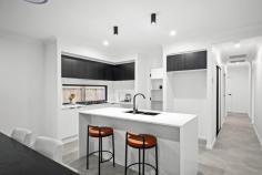  26 Gower Street White Rock QLD 4306 $829,000 Essential Details and FAQ: 209m² Home on a 336m² Block 4 Bed, 2 Bath, 2 Car 2 Living Areas Brand New, Never Lived In Built in June 2025 by AMT Build White Rock Estate Currently Vacant. Furniture is staged Council Rates: Approx $600/quarter Rental Appraisal: $650-$670/week 2.6m Upgraded Ceilings Throughout Ducted Air Conditioning Throughout Essential Documents: Brand new and impeccably finished, this stylish home features two generous living areas, a separate study nook, and a sleek kitchen with stone benches and a 900mm oven. The master retreat boasts a stylish ensuite and walk-in robe, while the alfresco flows seamlessly from the open-plan living area. With ducted air, upgraded ceilings, and premium finishes throughout, this home is ready for you to move in and enjoy low-maintenance living in White Rock. Structural Features and Design Single storey with 2.6m upgraded ceilings throughout Ducted air-conditioning throughout for year-round comfort Completely brand new with stylish and on-trend finishes Bedrooms and Bathrooms 4 spacious bedrooms with mirrored built-ins, ducted air, ceiling fans, security screens and roller blinds Generous master suite with large walk-in robe, air-conditioning and luxurious ensuite Ensuite features oversized shower, floating vanity, floor-to-ceiling feature tiles, on-trend black finishes and toilet Main bathroom includes bath, shower and separate toilet with stylish floor-to-ceiling tiles Kitchen and Living Areas Air-conditioned open-plan kitchen, living and dining flowing to tiled alfresco Gourmet kitchen with stone benchtops, 5-burner gas cooktop, 900mm oven, dishwasher, fridge space and walk-in pantry Second living space - perfect as a media or family room Functional study nook positioned at the front of the home Outdoors * Tiled alfresco entertaining area * Low-maintenance yard on a 336m² block Utilities and Additional Features Separate laundry with external access Opticomm internet Mains gas connection Gas hot water system Location: Zoned for Fernbrooke State School (Primary - 8 Minutes) Zoned for Ripley Valley State Secondary College (Secondary - 9 Minutes) 4 Minutes Walk to Whiterock Adventure Playground and Splash Pad 8 Minutes to Ripley Town Centre Shopping (Coles) 15 Minutes to Springfield Train Station 21 Minutes to Ipswich Hospital 24 Minutes to RAAF Amberley 45 Minutes to Brisbane CBD Flood-Free Area Easy access to Centenary Highway 