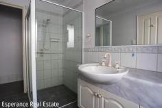  25 Walmsley Street Castletown WA 6450 $785,000 Positioned on a generous 1,013m² block and just a short 450m stroll to the sparkling shores of Castletown Beach, this well-maintained 4-bedroom, 2-bathroom brick and iron home offers space, comfort, and coastal convenience. Built in 2001, the home boasts a functional and family-friendly layout with multiple living areas, including a large open-plan kitchen, dining, and living space featuring reverse-cycle air conditioning and gas bayonet point. The timber kitchen is well-equipped with electric cooking appliances, a dishwasher, and rainwater plumbed to the sink. A formal lounge room is separated by French Doors and includes a gas wood-look tile fire that provides a cosy ambience. The master bedroom suite includes a walk-in robe and private ensuite. All minor bedrooms are generously sized and include built-in robes. The main bathroom offers a separate shower, vanity, and bathtub, complemented by a spacious laundry. Property Highlights: • Double garage with remote doors and internal access under the main roof • Side access to a large rear yard • Paved patio under the main roof – ideal for outdoor entertaining • 6m x 6m powered workshop with concrete floor and dual roller doors • Established front and rear gardens with reticulated lush lawns • Rainwater tank and water softener system Ideal for families, retirees, or anyone seeking a relaxed coastal lifestyle, this home ticks all the boxes. With room to move and grow, plus easy access to the beach, schools, and shops, it’s the perfect place to call home. 
