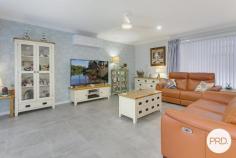  5 Golden Grove Dunbogan NSW 2443 $890,000 - $940,000 Nestled in the serene neighbourhood of Dunbogan and boasting a splendid blend of luxury and ease, 5 Golden Grove is a contemporary haven tailor-made for discerning downsizers, retirees, or astute investors. This modern three-bedroom, two-bathroom house is situated on a comfortably-sized 479.6sqm plot, ensuring a low maintenance lifestyle, mere moments from the tranquil beaches that define this idyllic locale. The residence greets you with a free-flowing floorplan accentuated by natural light filtering through elegant plantation shutters. Every detail speaks of quality, from the floor to ceiling tiles that grace the bathrooms, featuring a "his and hers" vanity in the ensuite, to the 40mm stone benchtops and modern appliances that make the kitchen both a functional and stylish space. Living areas transition seamlessly to the outdoors, where a large, covered timber deck offers a spectacular outlook to North Brother Mountain. The outdoor space, complete with a low maintenance yard, invites effortless entertainment or a peaceful retreat for a morning cuppa. A gentle 450m stroll unveils the golden sands of Dunbogan South Beach, while a 5-minute drive brings the soothing waves of Pilot Beach to your doorstep. Boating enthusiasts will appreciate the proximity to the nearest boat ramp, a mere 1.7km away, and the convenience of Laurieton CBD's amenities within a 5-minute drive. This property presents a remarkable opportunity to acquire a slice of coastal paradise, without compromising on comfort or quality. Embrace a life where beachside bliss meets modern luxury at 5 Golden Grove. 