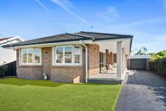  76 Waratah Street Windang NSW 2528 $1,290,000 A dream home that anyone would be lucky to call their own, this beautifully presented four-bedroom property is proudly set on a level block in a quiet, family-friendly location. With a timeless canvas, complemented by tasteful plantation shutters, ducted air conditioning and floorboards throughout this light-filled residence offers an oversized gourmet kitchen with ample storage, a fridge drawer and a duo oven with inbuilt grill. The main bedroom is a true sanctuary, boasting a walk-in wardrobe and a recently renovated ensuite, while the recessed lounge room and separate dining area create an inviting setting for effortless family living and entertaining. Step outside and discover a fully fenced, low-maintenance backyard with a seamless mix of decking and grass, designed for both relaxation and connection with endless opportunities to maximise every square inch of space. Adding to the appeal, the tandem garage offers secure parking for two vehicles with enough room leftover for bikes, tools, or weekend adventure gear. level block, tandem garage main bedroom with WIR, ensuite plantation shutters, ducted a/c recently renovated bathrooms cosy backyard, internal laundry 