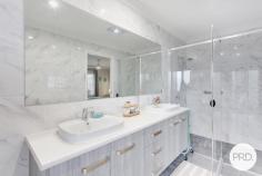  5 Golden Grove Dunbogan NSW 2443 $890,000 - $940,000 Nestled in the serene neighbourhood of Dunbogan and boasting a splendid blend of luxury and ease, 5 Golden Grove is a contemporary haven tailor-made for discerning downsizers, retirees, or astute investors. This modern three-bedroom, two-bathroom house is situated on a comfortably-sized 479.6sqm plot, ensuring a low maintenance lifestyle, mere moments from the tranquil beaches that define this idyllic locale. The residence greets you with a free-flowing floorplan accentuated by natural light filtering through elegant plantation shutters. Every detail speaks of quality, from the floor to ceiling tiles that grace the bathrooms, featuring a "his and hers" vanity in the ensuite, to the 40mm stone benchtops and modern appliances that make the kitchen both a functional and stylish space. Living areas transition seamlessly to the outdoors, where a large, covered timber deck offers a spectacular outlook to North Brother Mountain. The outdoor space, complete with a low maintenance yard, invites effortless entertainment or a peaceful retreat for a morning cuppa. A gentle 450m stroll unveils the golden sands of Dunbogan South Beach, while a 5-minute drive brings the soothing waves of Pilot Beach to your doorstep. Boating enthusiasts will appreciate the proximity to the nearest boat ramp, a mere 1.7km away, and the convenience of Laurieton CBD's amenities within a 5-minute drive. This property presents a remarkable opportunity to acquire a slice of coastal paradise, without compromising on comfort or quality. Embrace a life where beachside bliss meets modern luxury at 5 Golden Grove. 