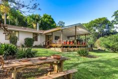  293 Rosebank Rd Rosebank NSW 2480 $1,385,000 - $1,420,000 This charming four-bedroom rendered brick home offers spacious living areas featuring a combined timber kitchen and dining area, which flows onto an all-weather entertaining deck. The split-level lounge area is bright and airy, complete with a combustion heater for added warmth and ambiance. Each of the generously sized bedrooms comes with built-in robes, and the master suite contains a private ensuite. Both bathrooms have been renovated, with the main family bathroom offering a separate bath and shower. A large laundry area provides convenient access to the back deck, and includes a third renovated bathroom designed specifically for the inground pool area. The separate garage hosts a sizable home office space, which could easily be transformed into additional studio accommodation. The property’s grounds are well-maintained and visually appealing outdoor space. The house yard is fully fenced with pet-friendly materials, and is home to an impressive variety of fruit trees, including citrus, bananas, pecans, and mangoes. Set on 2-hectare (5-acre), the land is gently sloping and features picturesque frontage to the tranquil Yankee Creek, shaded by mature Eucalypts and native trees. There is plenty of room for grazing or keeping a horse. The location offers peace and privacy, close to Rosebank pre-school and primary school while being just 20 minutes from Lismore, providing easy access to amenities and services. This property offers a unique lifestyle opportunity with room to grow and enjoy nature. 