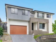  17 Brooks Terrace Kanahooka NSW 2530 $1,175,000 - $1,250,000 A large family home in a sought after location presents here at 17 Brooks Terrace, Kanahooka. Perfect for a large family, this split level home has a functional floorplan that provides plenty of space and privacy and a downstairs bedroom/ living space that is perfect for elderly guests or for teenagers wanting to entertain friends. With captivating views of Lake Illawarra from the gorgeous kitchen/ dining area, this is the space that friends and family will want to be entertained. Located just minutes to schools, shops, public transport. freeway access, Dapto CBD, Dandaloo Hotel and the Lake Illawarra foreshore, this is an opportunity not to be missed.' Featuring • 4 Bedrooms • Master with walk in wardrobe and ensuite • Downstairs bedroom, rumpus, bathroom and storage • Gorgeous kitchen with Views of the Lake • Spacious living areas • Study • Double Garage • Lake Illawarra Views • 491sqm corner block in a quiet estate 