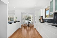  76 Waratah Street Windang NSW 2528 $1,290,000 A dream home that anyone would be lucky to call their own, this beautifully presented four-bedroom property is proudly set on a level block in a quiet, family-friendly location. With a timeless canvas, complemented by tasteful plantation shutters, ducted air conditioning and floorboards throughout this light-filled residence offers an oversized gourmet kitchen with ample storage, a fridge drawer and a duo oven with inbuilt grill. The main bedroom is a true sanctuary, boasting a walk-in wardrobe and a recently renovated ensuite, while the recessed lounge room and separate dining area create an inviting setting for effortless family living and entertaining. Step outside and discover a fully fenced, low-maintenance backyard with a seamless mix of decking and grass, designed for both relaxation and connection with endless opportunities to maximise every square inch of space. Adding to the appeal, the tandem garage offers secure parking for two vehicles with enough room leftover for bikes, tools, or weekend adventure gear. level block, tandem garage main bedroom with WIR, ensuite plantation shutters, ducted a/c recently renovated bathrooms cosy backyard, internal laundry 