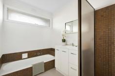  28 Grimwade Crescent Frankston VIC 3199 $750,000 - $800,000 Highlighting its due north orientation, this three-bedroom home welcomes a cascade of natural light into every room, beautifully complemented by rich solid timber floors to evoke a warm and cosy atmosphere. It boasts a prime location, conveniently situated between John Paul College and Karingal Primary School, making life easy for families no matter the stage. A low-maintenance frontage and a solid brick exterior frame a thoughtful interior design, where two separate living zones and a dedicated dining space centre an all-original kitchen, featuring a benchtop oven and electric cooktop, a curved breakfast bar, and plenty of bench space. A protected sun-drenched patio introduces the secure yard, where a flat grassy play space unfolds amongst established gardens, perfect for little adventurers. Catering to growing families with three bedrooms and 2-bathrooms including a street-facing master retreat with walk-in robe and ensuite. Complete with two split-system heating and cooling units, solar power, recently polished timber floors, a rear garden shed, and a tandem carport with drive-through access, this potential-packed home sits within easy reach of the Beach Street shops, both Frankston and Karingal's major retail, public transport, and easy access to all major arterials. 