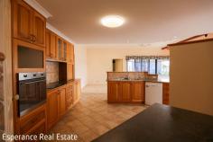  25 Walmsley Street Castletown WA 6450 $785,000 Positioned on a generous 1,013m² block and just a short 450m stroll to the sparkling shores of Castletown Beach, this well-maintained 4-bedroom, 2-bathroom brick and iron home offers space, comfort, and coastal convenience. Built in 2001, the home boasts a functional and family-friendly layout with multiple living areas, including a large open-plan kitchen, dining, and living space featuring reverse-cycle air conditioning and gas bayonet point. The timber kitchen is well-equipped with electric cooking appliances, a dishwasher, and rainwater plumbed to the sink. A formal lounge room is separated by French Doors and includes a gas wood-look tile fire that provides a cosy ambience. The master bedroom suite includes a walk-in robe and private ensuite. All minor bedrooms are generously sized and include built-in robes. The main bathroom offers a separate shower, vanity, and bathtub, complemented by a spacious laundry. Property Highlights: • Double garage with remote doors and internal access under the main roof • Side access to a large rear yard • Paved patio under the main roof – ideal for outdoor entertaining • 6m x 6m powered workshop with concrete floor and dual roller doors • Established front and rear gardens with reticulated lush lawns • Rainwater tank and water softener system Ideal for families, retirees, or anyone seeking a relaxed coastal lifestyle, this home ticks all the boxes. With room to move and grow, plus easy access to the beach, schools, and shops, it’s the perfect place to call home. 