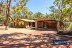  515 Marshwood Pl Sawyers Valley WA 6074 $1,000,000 Discover the ultimate retreat on a sprawling 4.94-acre property, where peace and tranquillity reign supreme—perfect for those seeking a serene escape from the hustle and bustle of everyday life. 4 beds, 2 bath plus office 1985 solid brick & iron Modern Kitchen/Laundry Raked timber ceilings Fresh tasteful decor R/C AC, open fireplace Below-ground pool Powered workshop Extensive R/water supply 4.94-acre bush block This stunning home features four spacious bedrooms, each equipped with built-in robes. The main bedroom boasts a luxurious en-suite and a generous walk-in robe, while a dedicated study with external access makes it an ideal space for your home business. Timber doors mark the threshold between the everyday and your private bush haven. Upon crossing this threshold, spotted gum floors extend a natural welcome while your gaze is drawn upward to raked timber-lined ceilings with exposed beams. This is a home that breathes with the rhythm of the surrounding bushland. Step down from the kitchen to find the north-facing meals area and family room, where a wall of glazing frames views of the natural landscape. Slide open the door to access the poolside entertaining zone that wraps around the rear of the home. This design transforms everyday meals into al fresco experiences, and hosting gatherings is a joy rather than a logistical challenge. The second bathroom is thoughtfully designed with both a shower and a bath, ensuring comfort for family and guests alike. Step outside to your very own paradise! Dive into the refreshing below-ground saltwater pool or cultivate your green thumb in the shade house and greenhouse, perfect for growing your own vegetables. Enjoy the bounty of nature with an array of fruit trees under cover in the shade house. Approximately 300,000 litres of rainwater capacity, monitored via a Smart Water system, demonstrate the property’s self-sustainable credentials, while reticulation to lawns, gardens and the shade house ensures that your green investment thrives even during your absence. For the handy individuals, this sale comes with an incredible assortment of tools and equipment that will ignite your creativity and productivity! Included in this fantastic package are: **Makita Cutoff Saw (Wood)** **Wia 250i Mig Welder** **Boc HF Tig Welder** **Oxy Acetylene Set** **Steel Bench with 6” Vise** **Small Metal Lathe** **Air Compressor** **Dewalt Thicknesser Planer** **Carbatec Thicknesser Planer** **Drill Press** **Bench Grinder** **Linisher** **Jet 14” Bandsaw** **Hafco 18” Bandsaw** **Hafco 250mm Table Saw** **Sherwood 8” Jointer** **Sherwood Router Table and Router (Cast)** **Sherwood Wood Lathe** **Sherwood 3hp Full Workshop Extraction Unit** ** Kubota tractor and ride on mower** 