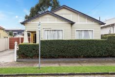  7 Hatton Grove Coburg VIC 3058 $1,180,000 - $1,280,000 Set in a quiet cul-de-sac and brimming with original character, this circa 1924 double-fronted Californian Bungalow offers a rare blend of heritage appeal and inner-city convenience. Proudly held by the same family for over 50 years, the home sits on a wide allotment just metres from the vibrant heart of Sydney Road's shops, cafés and trams. Freshly painted and immaculately presented, the home features manicured hedged gardens, soaring decorative ceilings with rosettes, polished Baltic pine floors, and a flexible layout comprising two generous bedrooms plus a study or optional third bedroom. Comfortable as is, yet offering outstanding potential to renovate or extend (STCA), the current floorplan includes a spacious lounge, separate dining room, gas-appointed kitchen, central bathroom and a sunroom that opens to a large, private backyard with a desirable northerly aspect. Additional highlights include gas heating, air conditioning, and a full side driveway leading to a double carport at the rear. Ideally located close to Coburg Lake, Merri Creek trails and market gardens, schools, John Fawkner Hospital, and just moments to trains and the CBD. 