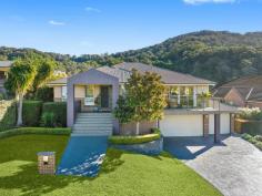  112 Valley Drive Figtree NSW 2525 Set on a generous 1,582sqm block, this beautifully presented four-bedroom family home captures picturesque escarpment views, providing a tranquil backdrop for daily living. Spread across two thoughtfully designed levels, the home is warm and welcoming, featuring a gas-equipped kitchen with stone benchtops and a walk-in pantry, combining style and practicality for passionate home cooks. Comfort is a priority, with two modern bathrooms enhanced by heated towel rails, reverse-cycle air conditioning in bedrooms one and two, an oversized triple garage and the convenience of solar hot water. Step outside to discover a spacious, backyard where family fun comes naturally. Whether you're hosting a lively weekend barbecue, tending to your lovingly manicured garden, or taking a refreshing dip in the in-ground pool complete with retractable covers, this outdoor oasis is designed for creating lasting memories. Set on a 1,582m² block, triple lock-up garage Main bedroom complete with WIR, ensuite Two living areas, large kitchen with gas cooktop In-ground pool with retractable covers Powder room, manicured gardens, wine cellar 