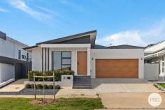  31 Mari Funaki Street Whitlam ACT 2611 Step into refined elegance, this architecturally designed home, perfectly positioned in the highly sought-after suburb of Whitlam. Positioned on an elevated block in the heart of Whitlam, This residence captures natural light throughout the day and offers a seamless blend of luxury, practicality, and comfort. Crafted to maximise natural light and space, the home features a striking open-plan living and dining area with soaring ceilings and expansive high-set windows. A separate formal lounge offers a quiet retreat. At the heart of the home, the designer kitchen is a true showpiece, boasting 40mm stone benchtops with waterfall edges, premium Bosch 900mm gas cooktop & appliances, and soft-close cabinetry-offering both practicality and contemporary style. Accommodation is generous, featuring a luxurious master suite with walk-in robe and sophisticated ensuite, a private guest bedroom with its own ensuite, and two additional bedrooms serviced by a designer bathroom and separate toilet. Outdoors, the alfresco entertaining area flows seamlessly from the family/dining area and easy care landscaped gardens designed for low-maintenance enjoyment. This premium home is enhanced by double-glazed windows, ducted reverse cycle heating and cooling, instantaneous hot water systems, and a 2000L water tank-delivering both comfort and energy efficiency. Located just moments from the Whitlam Community Playground, Molonglo River Reserve, and a short drive to Denman Village, Belconnen, and the Canberra CBD, this residence offers a perfect balance of lifestyle, location, and luxury. Property Highlights: Elevated block 419 m2 Single-level design with separate lounge room, family / Dining area Premium kitchen with 40mm stone, Bosch 900mm appliances & soft-close cabinetry Luxurious master suite with walk-in robe and large ensuite Guest suite with ensuite, plus two additional bedrooms with built-in robes Designer bathrooms Alfresco entertaining area & landscaped yard Ducted reverse cycle heating and cooling Double-glazed windows for energy efficiency instantaneous gas hot water systems 2000L water tank with pump High-quality finishes throughout Location Benefits: 2 mins walk to Whitlam Community Playground 5 mins walk to Molonglo River Reserve 8 mins drive to Denman Village Shops 11 mins drive to Westfield Belconnen 14 mins drive to Canberra CBD 