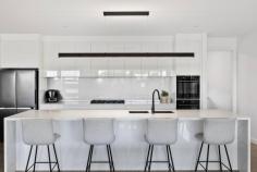  5 Banksia Court Moama NSW 2731 $1,700,000 - $1,850,000 Tucked away in a prestigious pocket in Murray Banks Estate Moama and only a stones throw away from the Murray River is this impeccably built home that offers the perfect blend of luxury, functionality, and lifestyle. From the moment you arrive, you'll be impressed by the craftsmanship and attention to detail that sets this property apart from others. From the moment you enter the front door you will be able to appreciate the grand entrance, high ceilings and the warm polished concrete floors. Off to one side of the home you will find the first three bedrooms all with walk in robes, ceiling fans and soft flowing sheers. The separate study allows for a quiet, focused environment away from the living rooms. The stunning main bathroom is fitted with an inviting bath, stylish tapware and plantation shutters for added privacy. There is a separate powder room that services this side of the home and guests. This section of the home also has a generously sized separate lounge that leads to the outdoor area and a view of the immaculately maintained rear yard. Off to the other side of the home is the beautifully presented open plan kitchen, main living and dining area that overlooks the outdoor area and sparkling inground pool. The lounge room has a cozy gas log fire perfect to sit around in the cooler months. The spectacular kitchen is perfect for entertaining and cooking. From the long stone island bench to the double wall ovens, all of the high end appliances will make you want to spend a lot more time in the kitchen. A stand out feature of the home is the huge walk in pantry that is fitted with a dishwasher, separate sink and extensive storage. The master suite is just off the main living area and has direct access outside through sliding doors. The bedroom has a beautiful ensuite with double shower, his and hers vanities and a separate toilet. This flows through to the spacious walk-in wardrobe. For added convenience the double car garage has double access to the home entering either to the entrance hallway or directly into the large mudroom and laundry. The mudroom and laundry have plenty of storage and is a large space that can be closed off from the main living area. The home is kept comfortable through all seasons with 2 ducted evaporative cooling systems, floor heating and the additional gas log fire in the living area. This list goes on, outside an outdoor entertaining area with exposed aggregate concrete, black industrial ceiling fans and an outdoor kitchen perfect for gatherings or quiet nights with family and friends. The inviting solar heated inground pool is perfect for warmer months surrounded by greenery for added privacy. The large yard allows for secure side access leading up to the large shed with a concrete base and a Coonara perfect for all your tools and your pride and joys. There is also potential for side access on the Southern side of the property if needed. Additionally there is a garden shed for added storage. This is a rare opportunity to secure a thoughtfully designed, high-quality home that blends relaxed living with exceptional functionality - just moments from the river. 