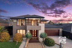  22 Cambridge Dr Berwick VIC 3806 $1,350,000 - $1,450,000 Grand Scale. Luxe Finish. Northside Prestige Built by the highly regarded Carlisle Homes, this impeccably maintained residence showcases enduring quality and a layout tailored for modern family life. Though well established, the home presents as if brand new, a testament to its timeless design and the care it’s received over the years. With five spacious bedrooms and three bathrooms, this home delivers rare flexibility, including two master suites, one on each level making it ideal for multi-generational families, guests, or those who value privacy. Multiple living zones, including a dedicated theatre room, offer space to relax, entertain, or retreat. The heart of the home is a bright and open kitchen, flowing seamlessly into the living and dining area and out to a generous alfresco space, perfect for entertaining or unwinding year-round. Tucked away in a quiet, tree-lined street on Berwick’s prized north side, the location offers both lifestyle and convenience. You’re just moments from leading schools, shopping, parkland, and public transport. A rare offering that combines space, sophistication, and functionality in one of Berwick’s most desirable neighbourhoods, this is a home that truly stands the test of time. 