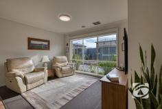  7 Balaton Dr Pakenham VIC 3810 $660,000 - $720,000 Immaculate Living in a Peaceful Pocket Tucked away in a quiet, family-friendly neighbourhood, this beautifully presented three-bedroom home with a separate study offers a perfect balance of space, style, and practicality. Designed for modern living, it features two generous living zones, a sleek kitchen with walk-in pantry and electric appliances, and a light-filled open-plan layout ideal for families and entertaining. All bedrooms are spacious with built-in robes, while the master enjoys a walk-in robe and private ensuite. The versatile study is perfect for working from home or use as a nursery. Outdoors, a large wrap-around pergola overlooks a lush, low-maintenance garden, providing the ideal space to relax or entertain. Additional highlights include a 6.6kW solar system, electric ducted heating and cooling, full-size laundry, and a double garage with rear roller access and space for extra vehicles. Immaculately maintained and move-in ready, this home delivers comfort, convenience, and quality in a peaceful, well-connected location. 