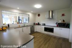  116 Sanctuary Crescent Pink Lake WA 6450 $1,118,000 Embrace the tranquility of lifestyle living just 13km from the heart of Esperance with this beautifully maintained 2.11-hectare property in sought-after The Sanctuary estate. Set amongst manicured grounds, the generous. modern rendered and insulated home offers: 4 spacious bedrooms, including a privately positioned master suite with walk-in robe and ensuite 2 bathrooms Central open plan living area incorporating dining, family and kitchen zones Well-equipped kitchen with walk-in pantry, ample bench space, electric cooktop, underbench oven and dishwasher Wood fireplace with Wetback system supporting the solar hot water system for energy efficiency Sun-filled entertaining patio perfect for relaxing or hosting Double carport plus freestanding caravan annexe for extra storage or guests Huge 13m x 12m shed with lined storage area and independent gas hot water system and bathroom. The fully reticulated block is serviced by a bore-fed 16,000L tank, complemented by a substantial 92,000L rainwater storage plumbed to the home. An ideal mix of space, privacy and comfort, this property offers a premium lifestyle opportunity within easy reach of town. 